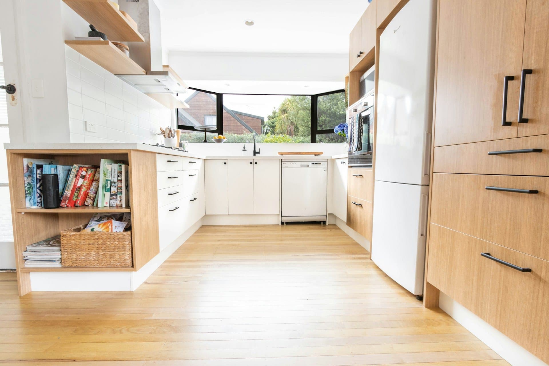Modern kitchen with light wood-look plank flooring